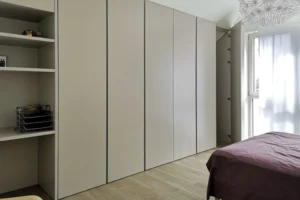 A Suave Wardrobe With An Attached Open Shelf For Bags